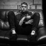 Joe Yorke sat on the sofa